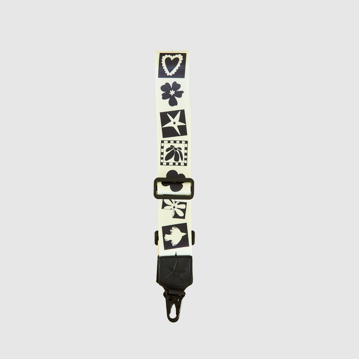 THE OG Strappi strap styled with a camera, showing length and attachment clips
