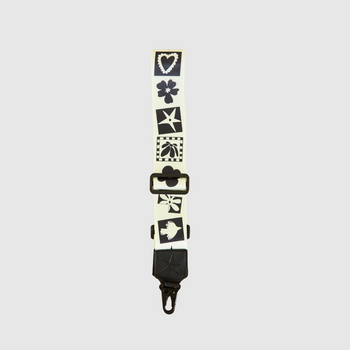 THE OG Strappi strap styled with a camera, showing length and attachment clips