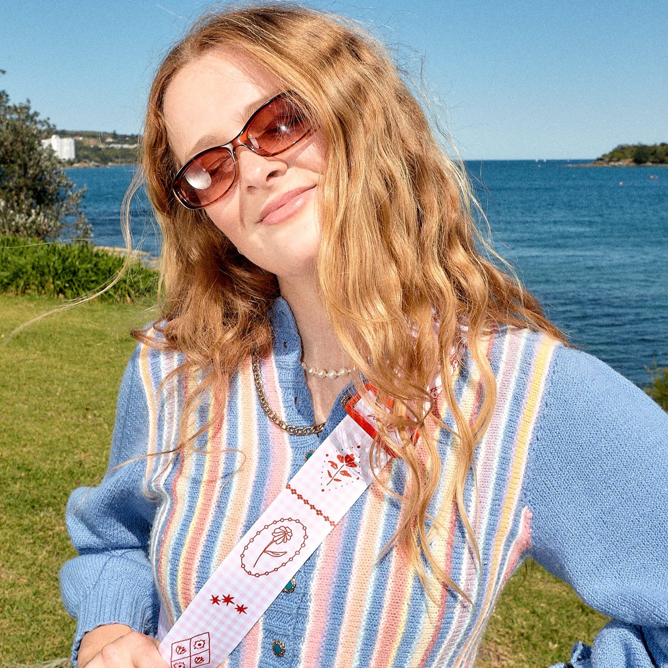 LOVED gingham Strappi strap worn across the body in a lifestyle shot