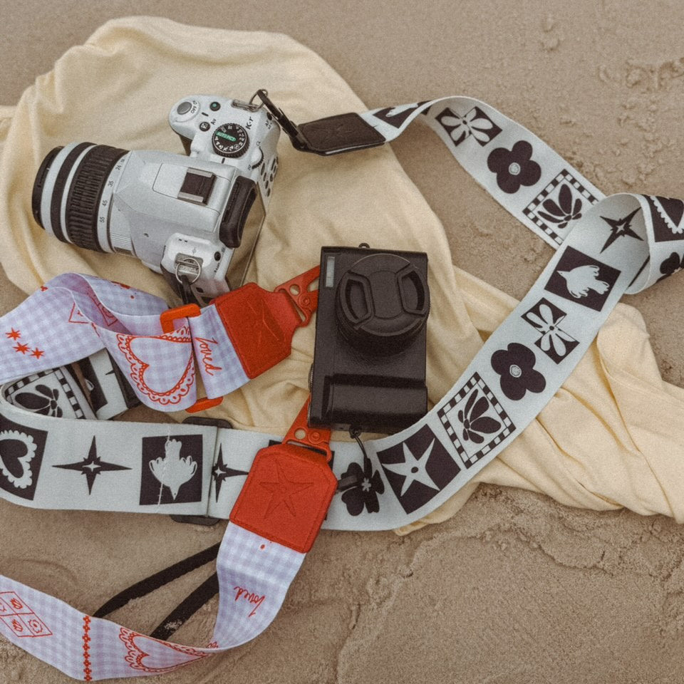 Lifestyle shot of THE OG black and white Strappi strap worn with a bag