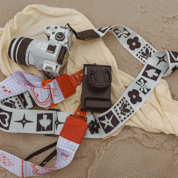 Lifestyle shot of THE OG black and white Strappi strap worn with a bag